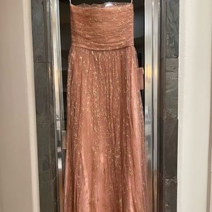 Gorgeous strapless floor length evening gown with tags.